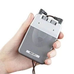 Person holding a handheld TENS machine with dials and wires.