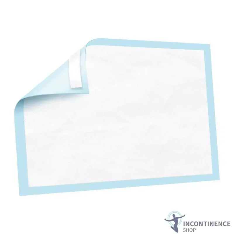 Disposable bed pad with blue border and corner folded.