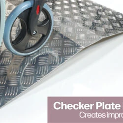 Wheelchair on aluminium ramp with checker plate finish.