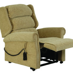 Beige recliner chair with extended footrest and remote control.