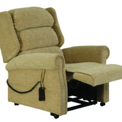 Beige recliner chair with extended footrest and remote control.