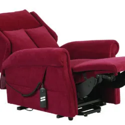 Red recliner chair with footrest extended and remote control attached.