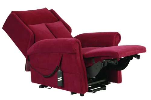 Red recliner chair with footrest extended and remote control attached.