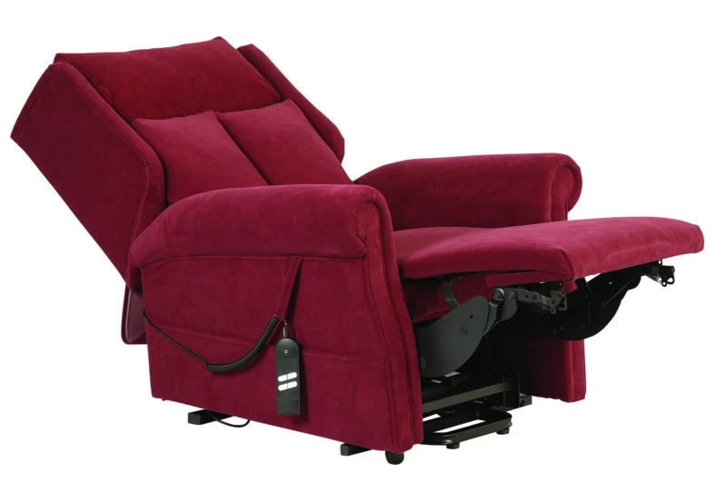 Red recliner chair with footrest extended and remote control attached.
