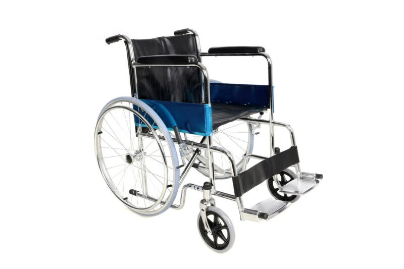Steel wheelchair with blue side panels and flip-up footrests.
