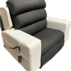 Black and white custom riser recliner chair with remote control.