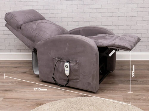 Reclined electric recliner chair with remote in side pocket.