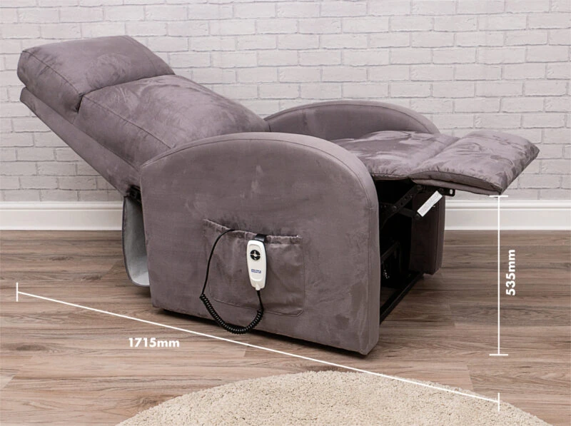 Reclined electric recliner chair with remote in side pocket.