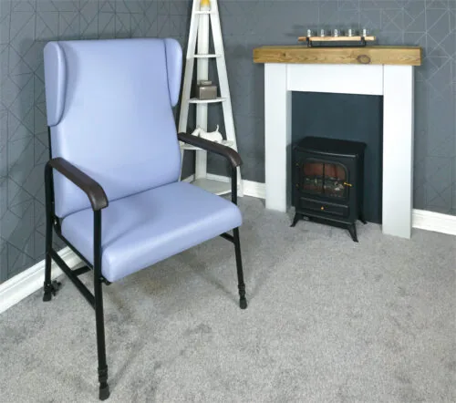 Light blue high back armchair with black frame in a cozy living room.