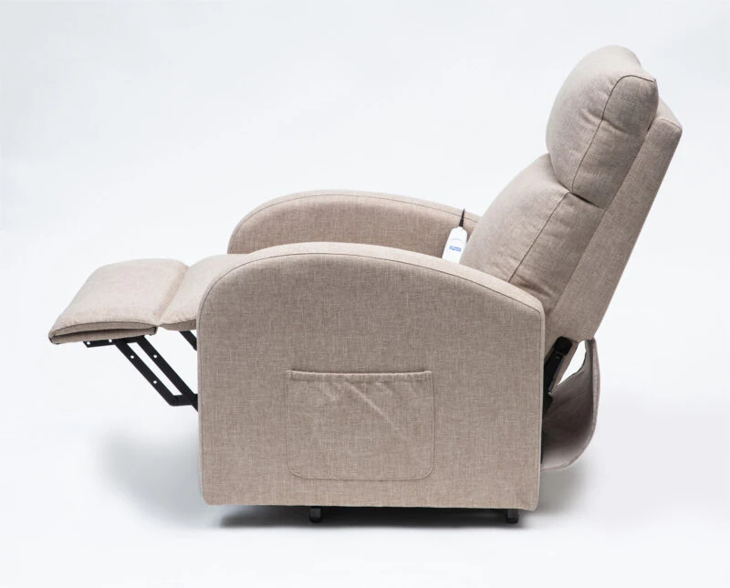 Side view of an oat-colored rise and recline chair with footrest extended.
