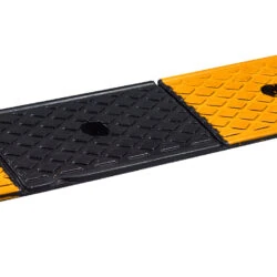 Rubber threshold ramp with alternating yellow and black sections.