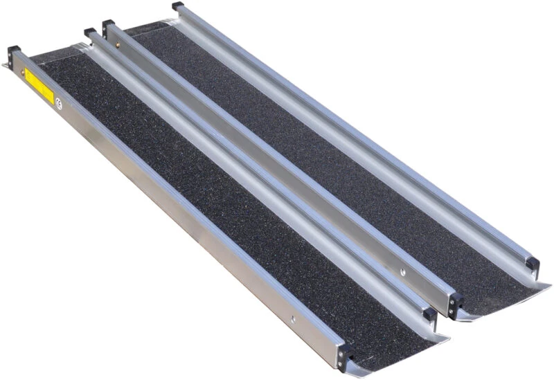 Telescopic wheelchair ramp with a gritted, non-slip surface and side rails.