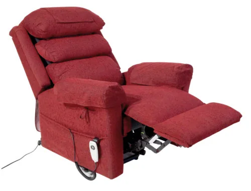 Red riser recliner armchair with extended footrest and remote control.