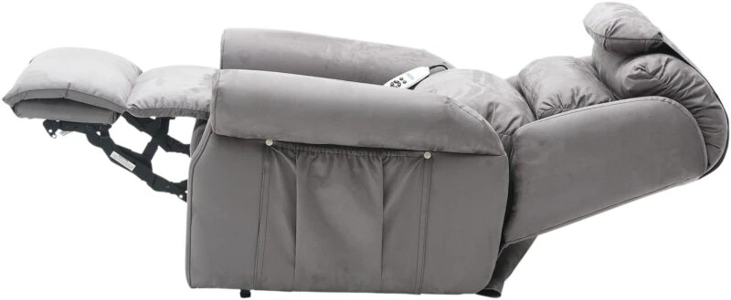 Grey armchair in full recline position, side view.