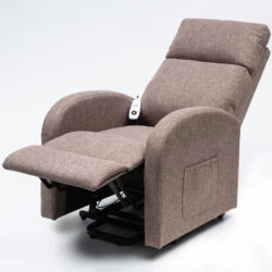 Brown recline chair with extended footrest and side pocket.