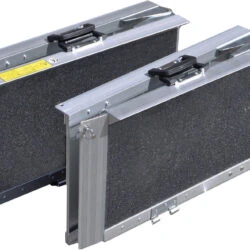 Two folded trifold ramps with gritted surfaces and handles.