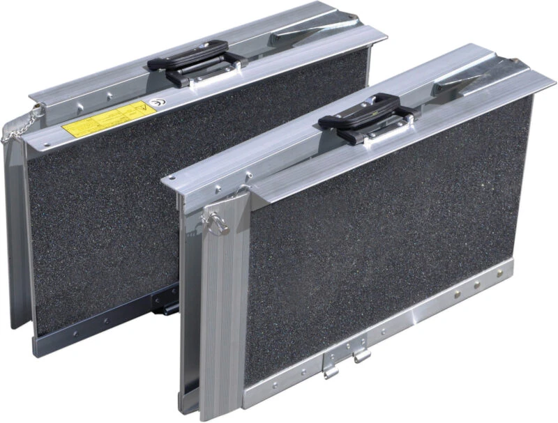 Two folded trifold ramps with gritted surfaces and handles.