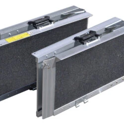 Two folded trifold ramps with gritted surfaces and handles.