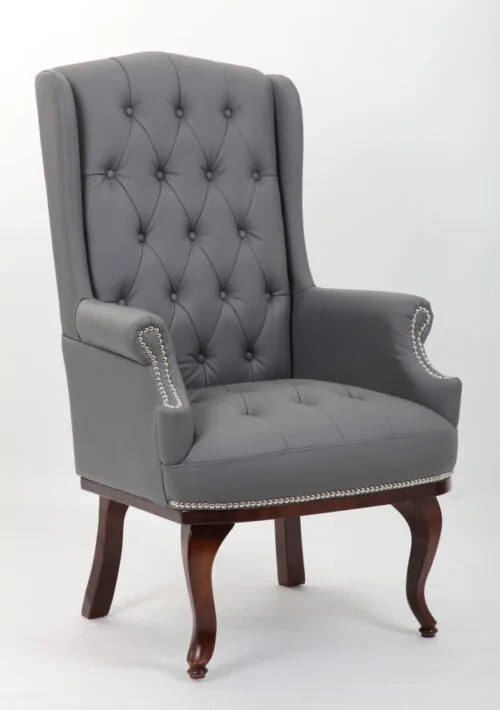 Grey high back armchair with dark mahogany legs.