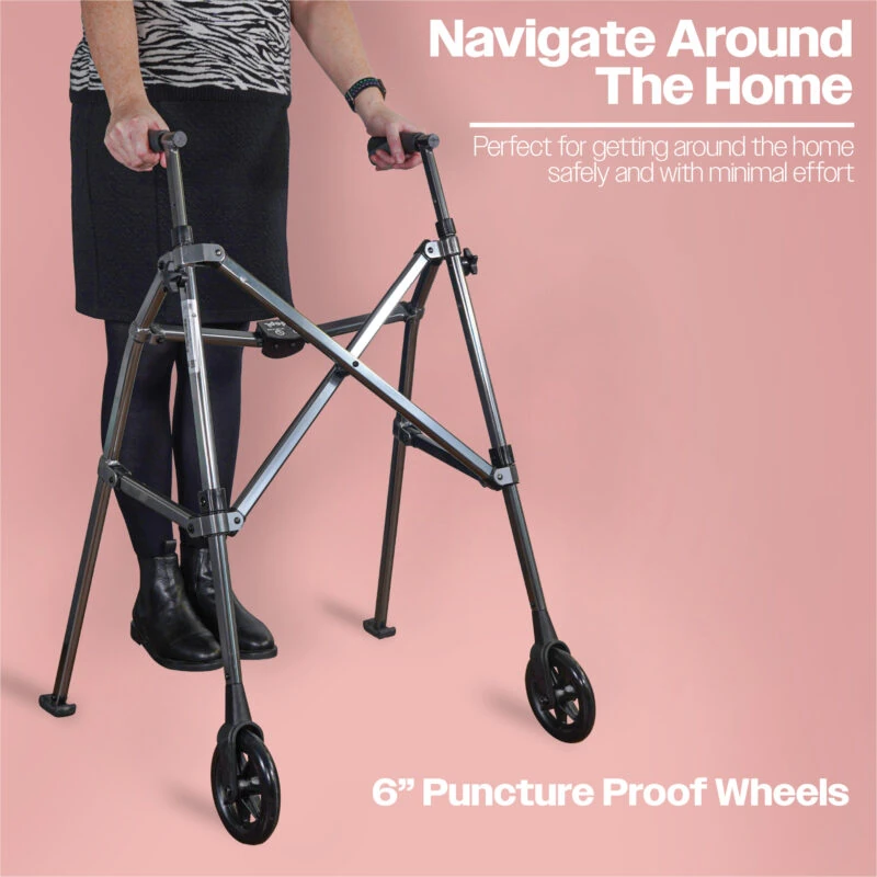 Person using a folding walking frame with wheels on a pink background.