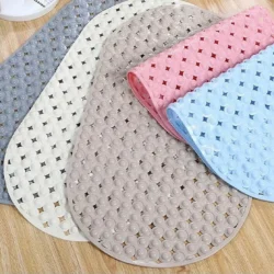 Five non-slip shower mats in various colors on a wooden floor.