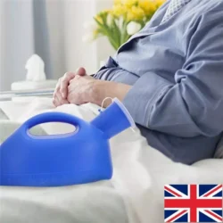 Blue portable urinal bottle with easy-grip handle next to a person in bed.