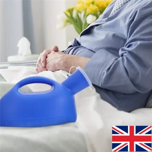 Blue portable urinal bottle with easy-grip handle next to a person in bed.