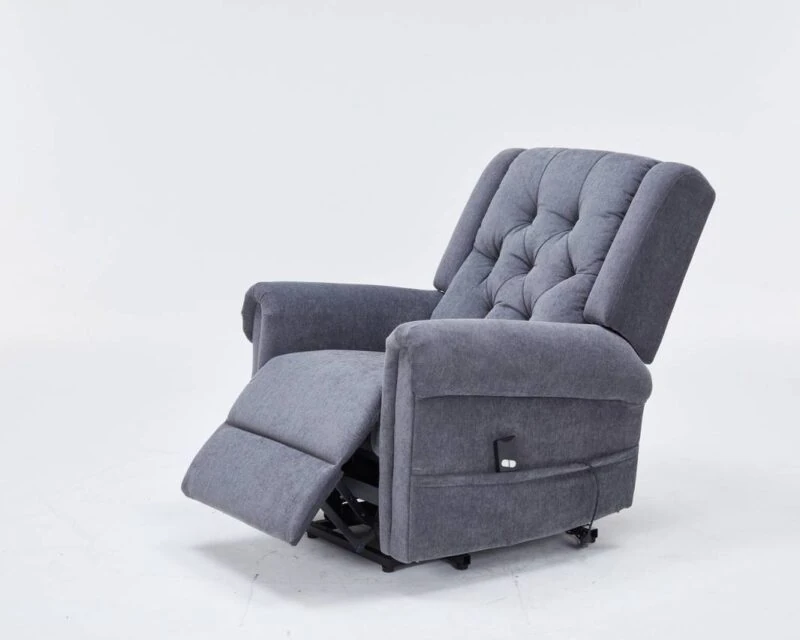 Grey recliner chair with buttoned back and extended footrest.