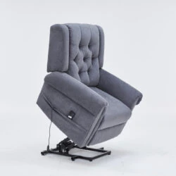 Grey recliner chair in a riser position on a white background.