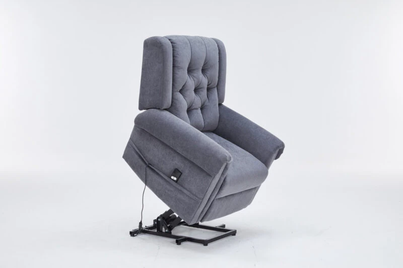 Grey recliner chair in a riser position on a white background.