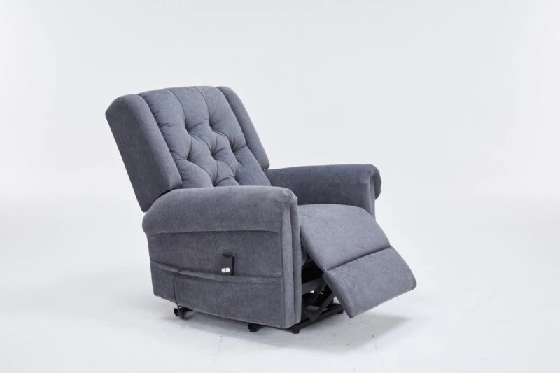 Grey recliner chair with extended footrest on a white background.