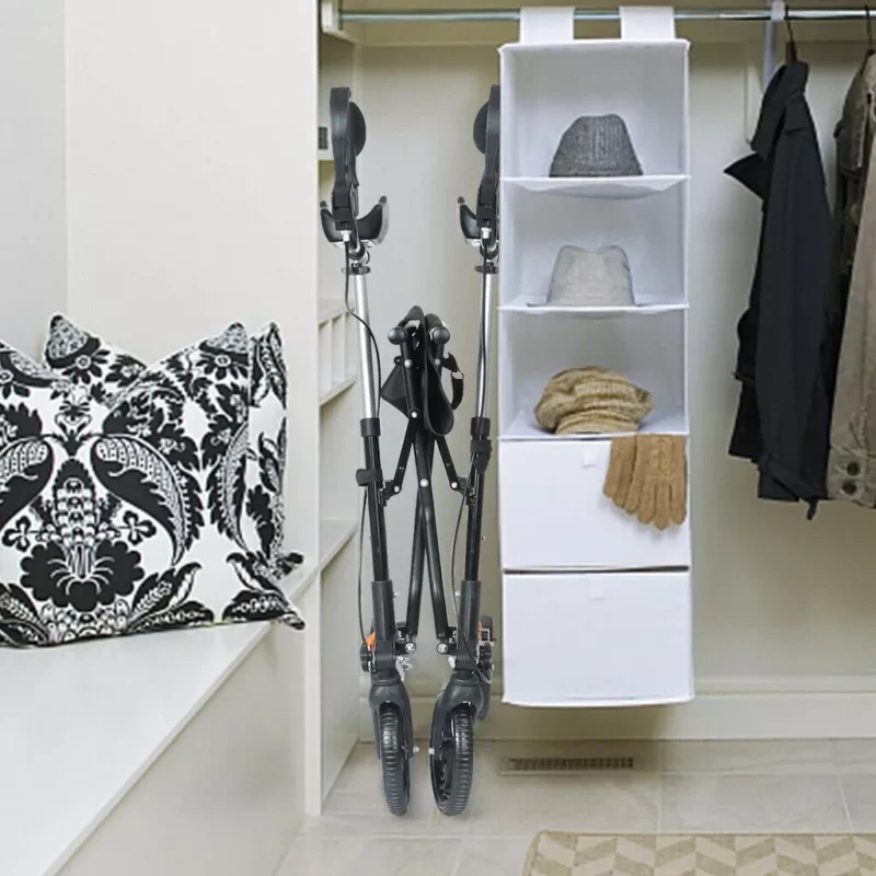 Folded mobility walker with forearm support stored in a closet.