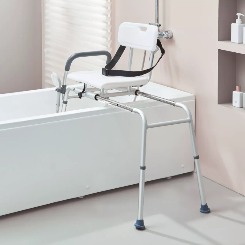 Shower transfer bench with sliding seat over a bathtub.