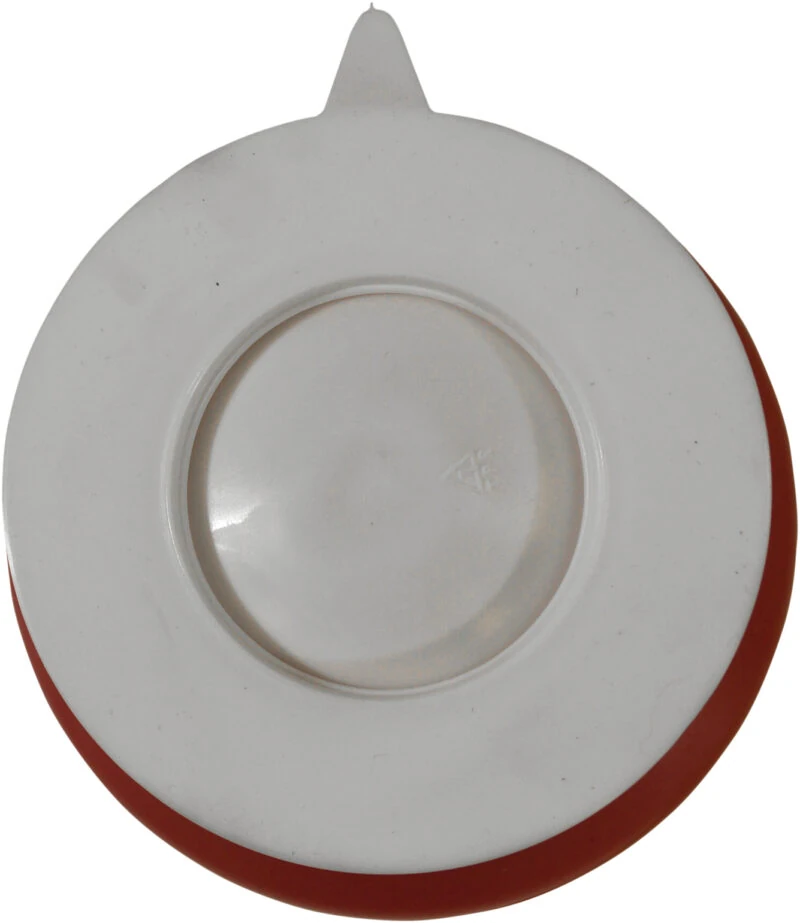 Top view of a white plate with a red suction base.