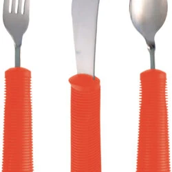Adaptive silverware set with red handles, including a fork, knife, and spoon.