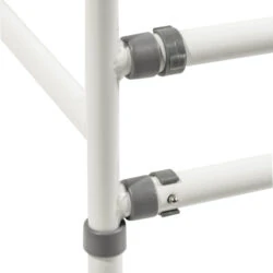 Close-up of adjustable joints on a white toilet safety frame.