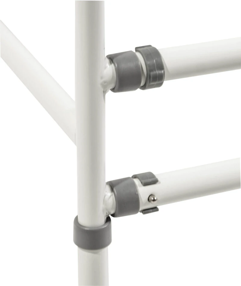 Close-up of adjustable joints on a white toilet safety frame.