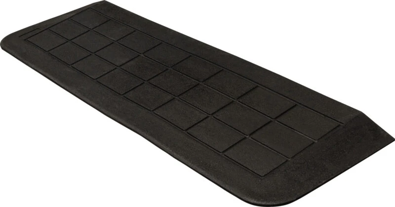 Black accessibility ramp with a textured surface.