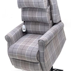 Gray plaid recliner chair with remote control attached.