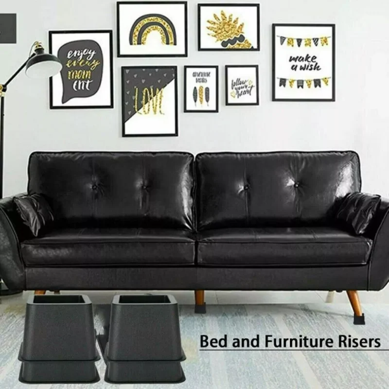 Black furniture raisers placed under a black sofa in a decorated living room.