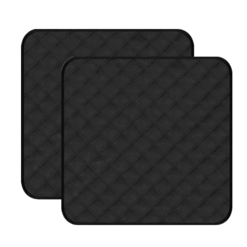 Two black quilted incontinence chair pads.