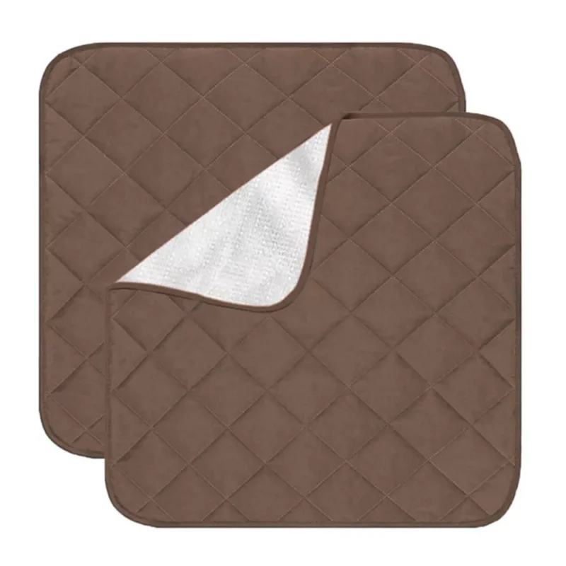 Two coffee-colored quilted incontinence chair pads, one partially folded to show underside.