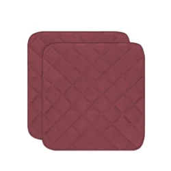 Two wine red quilted incontinence chair pads.
