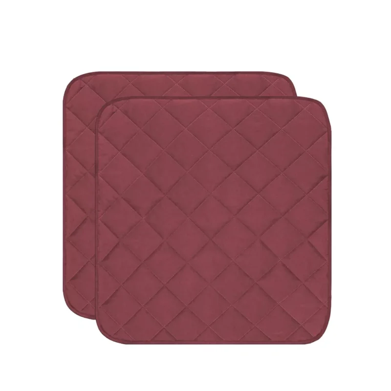 Two wine red quilted incontinence chair pads.