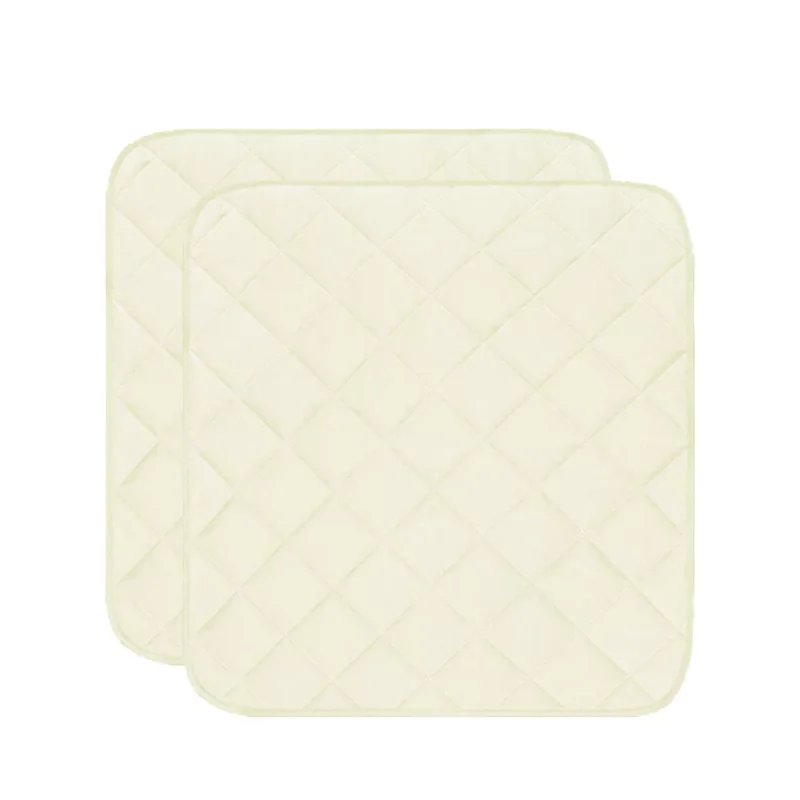 Two quilted chair pads with a diamond pattern.