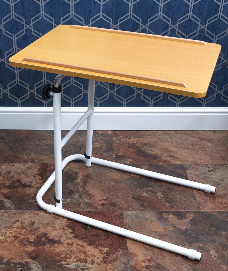 Overbed table with a beech melamine tabletop and white metal frame.