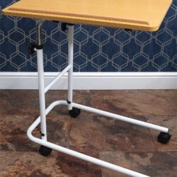 Overbed table with a beech melamine tabletop and castors.