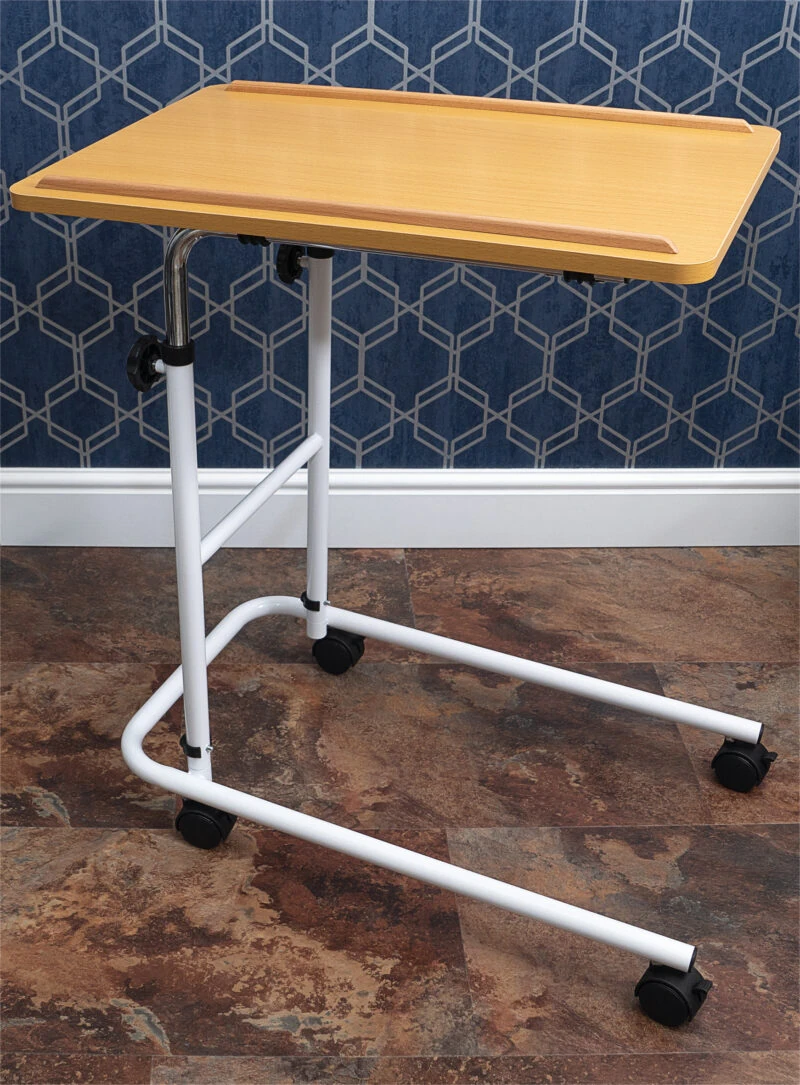 Overbed table with a beech melamine tabletop and castors.