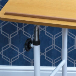 Close-up of overbed table with beech melamine tabletop and adjustment knob.