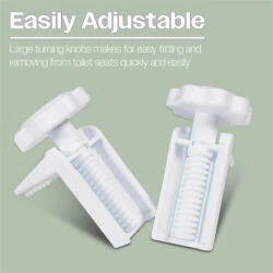 Close-up of adjustable white brackets for toilet seat installation.